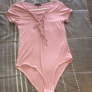 Pink laced down body suit